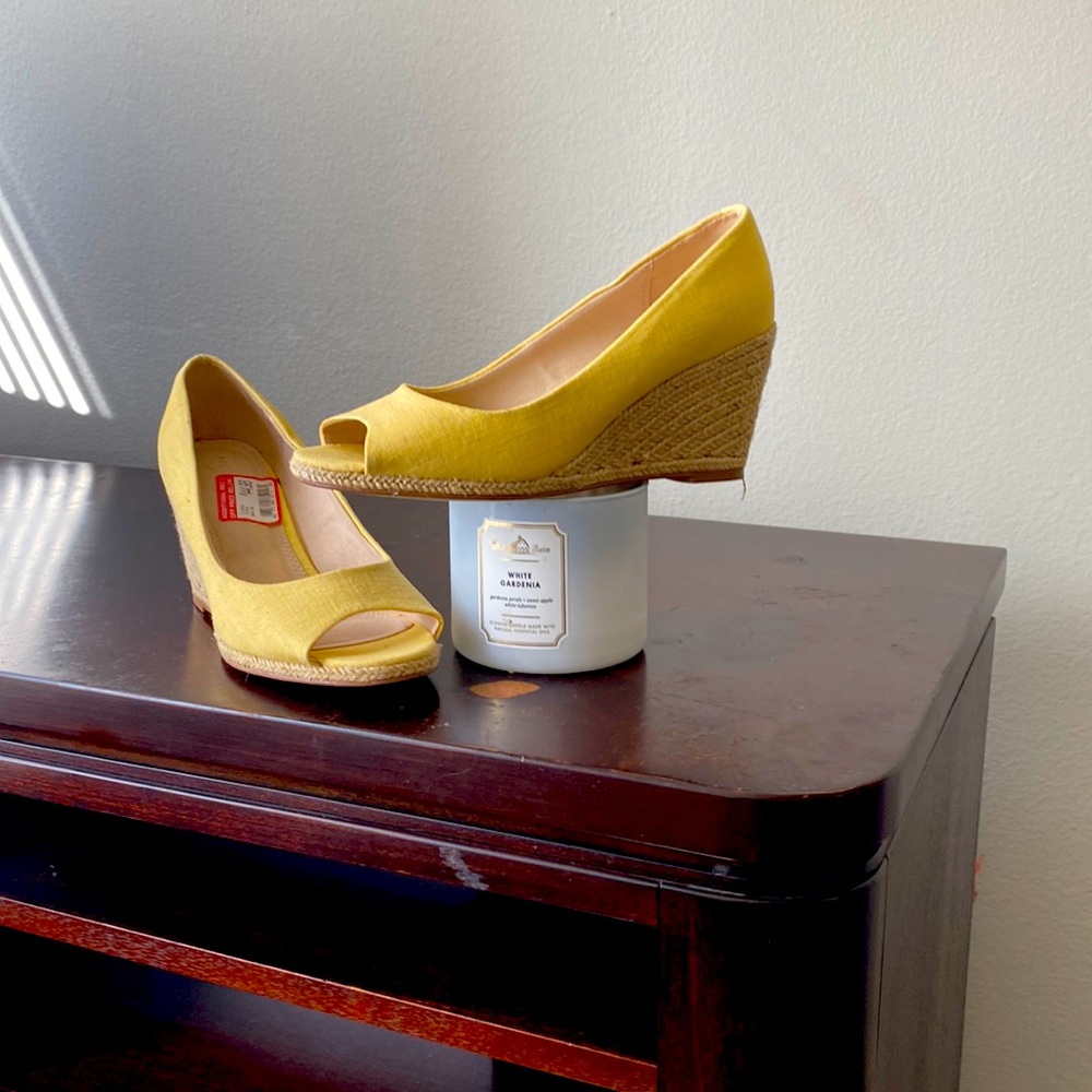 Stylish, never worn wedge. Will pair well with a lot!
